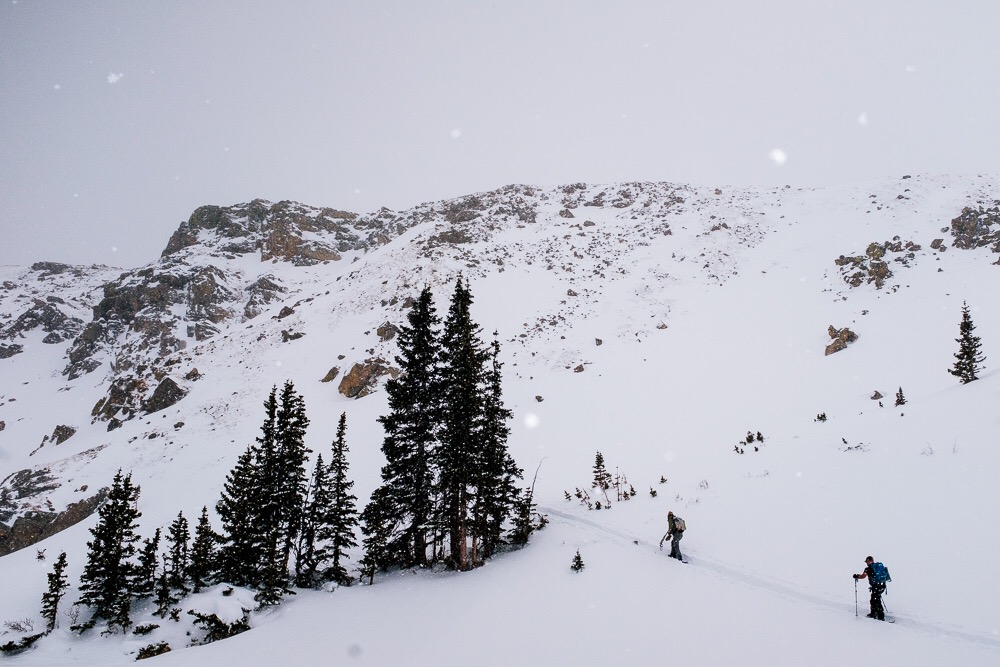 Skiers going uphill near Berthoud Pass